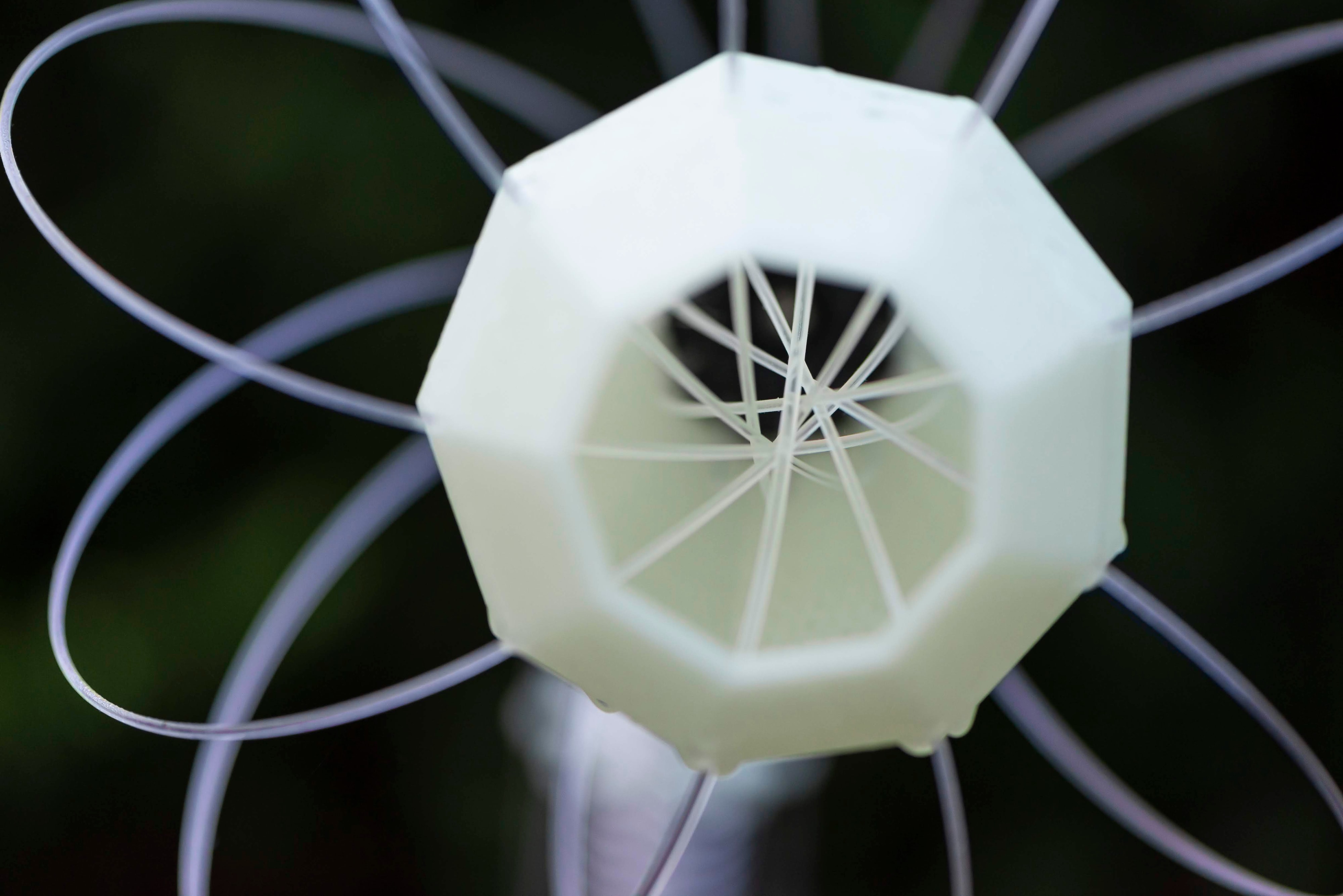 IXFID — macro of white 3D-printed geometric lamp structure with looping filaments