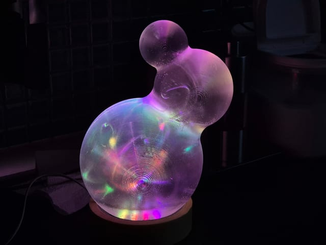 Iskanin — glowing 3D-printed translucent triple-sphere sculpture