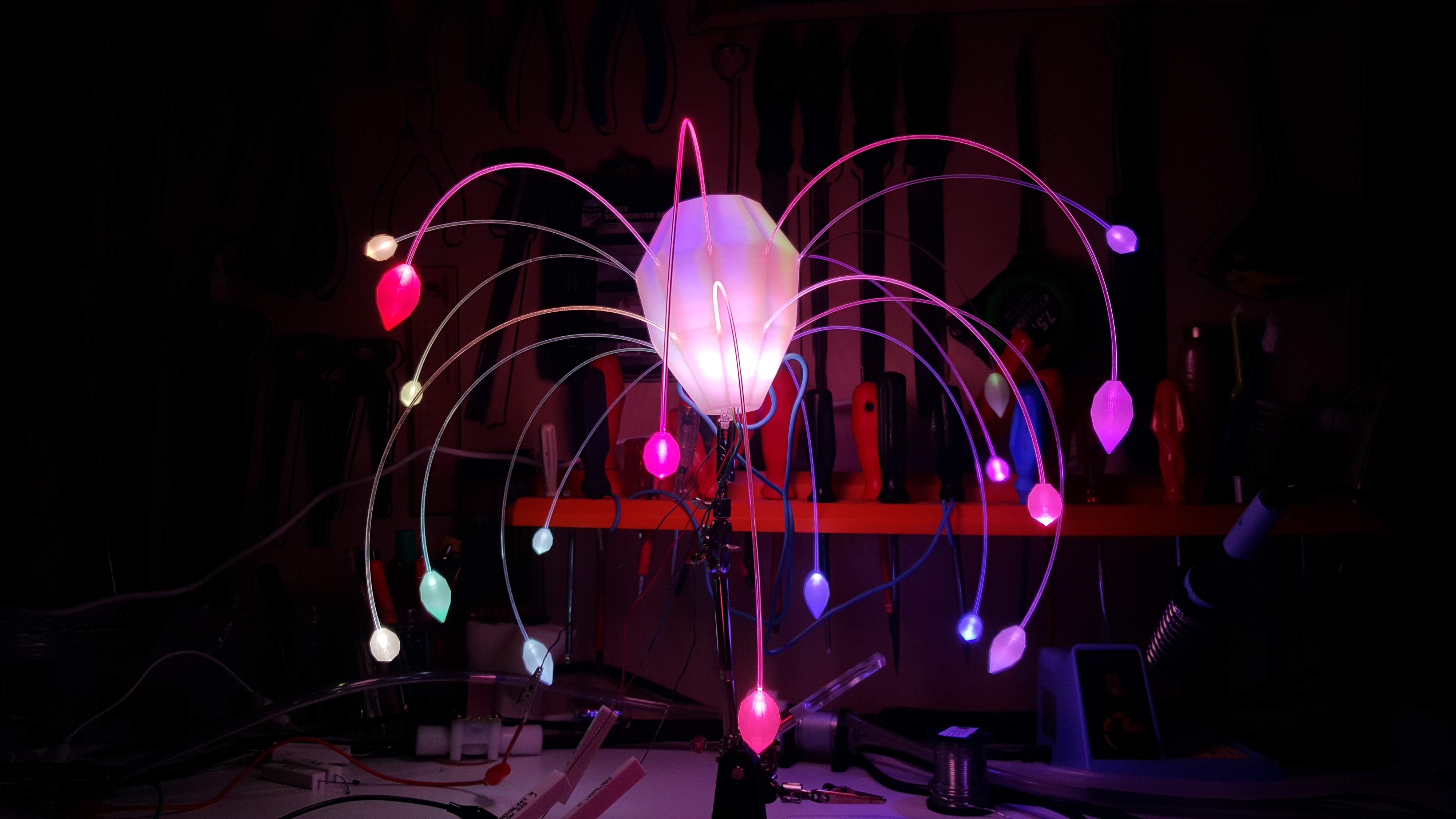 Tris — workshop detail of glowing flower lamp assembly