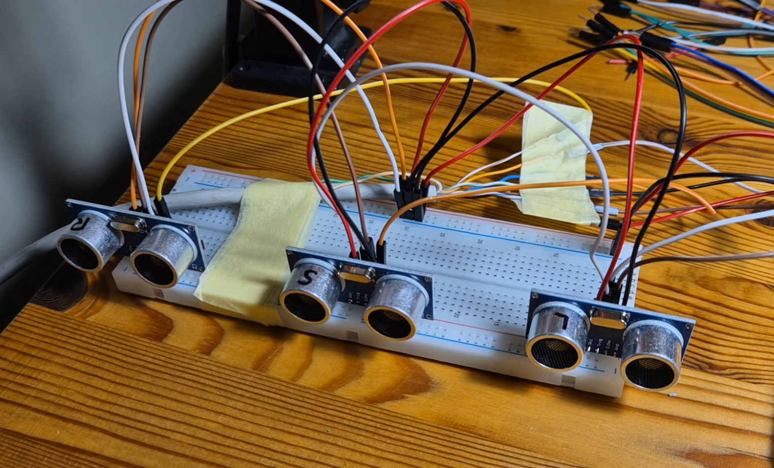 Eyes on the Metronome — breadboard with three ultrasonic distance sensors