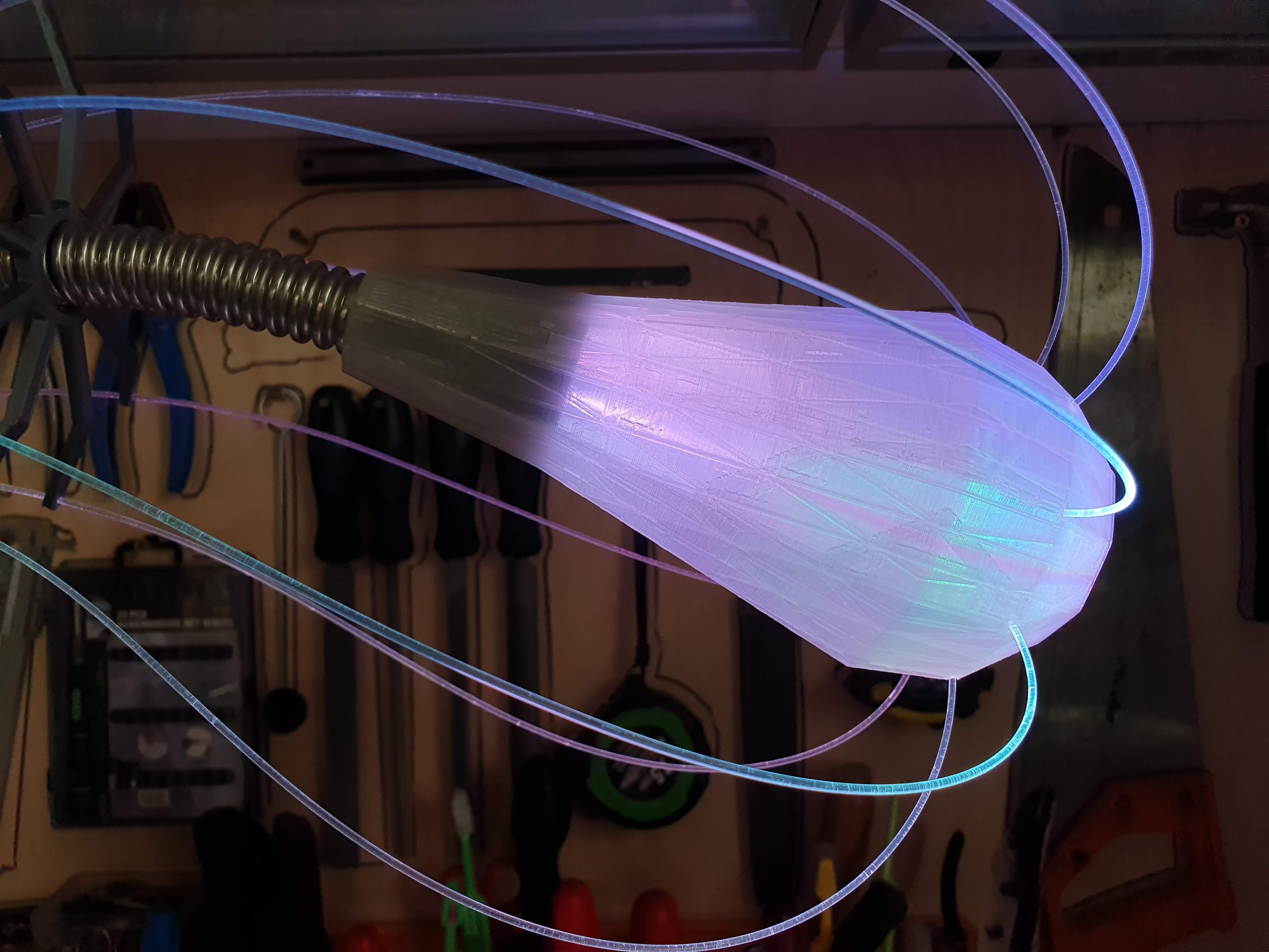 IXFID — purple faceted 3D-printed lamp head with fiber optics on a gooseneck arm