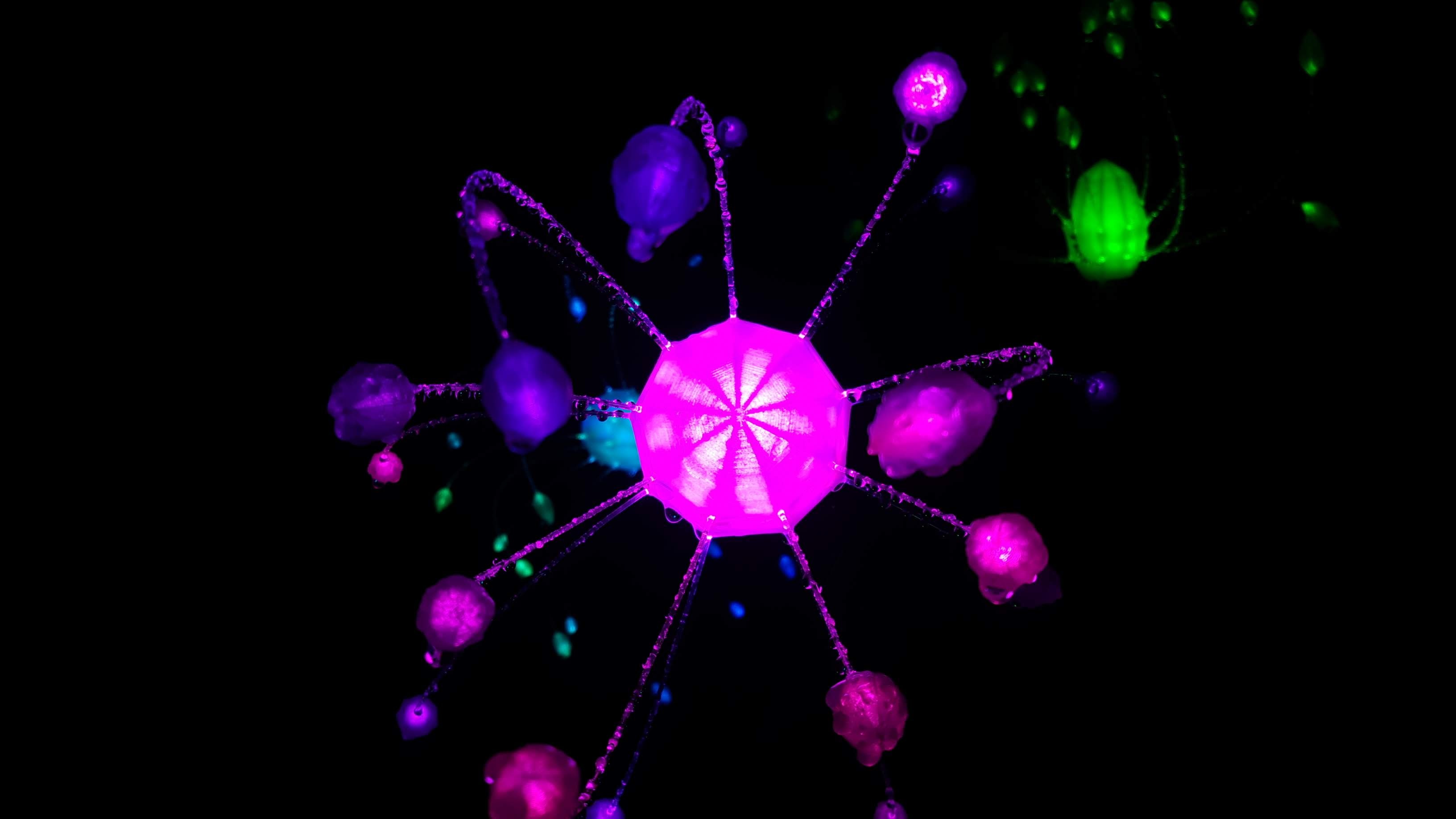 Tris — bioluminescent light sculpture with magenta hub and glowing pods