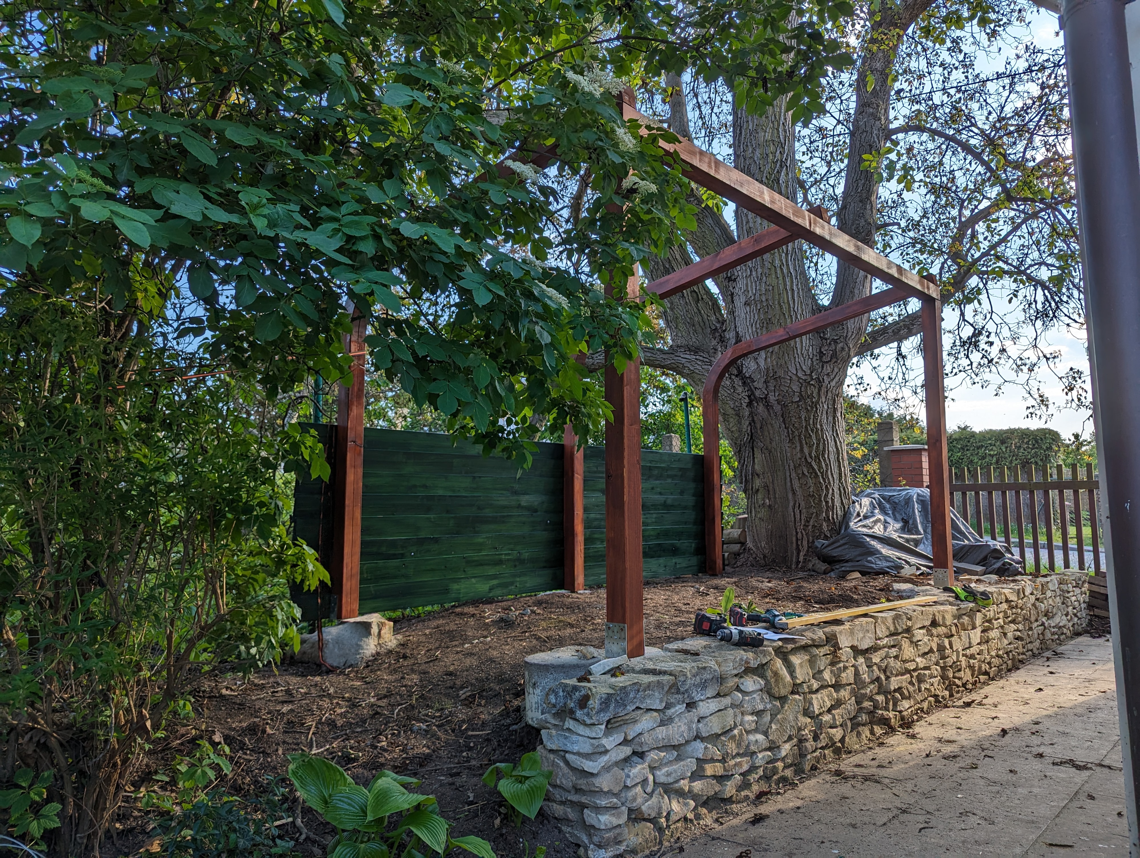 Woodgon — neatly split logs stacked in the woodshed