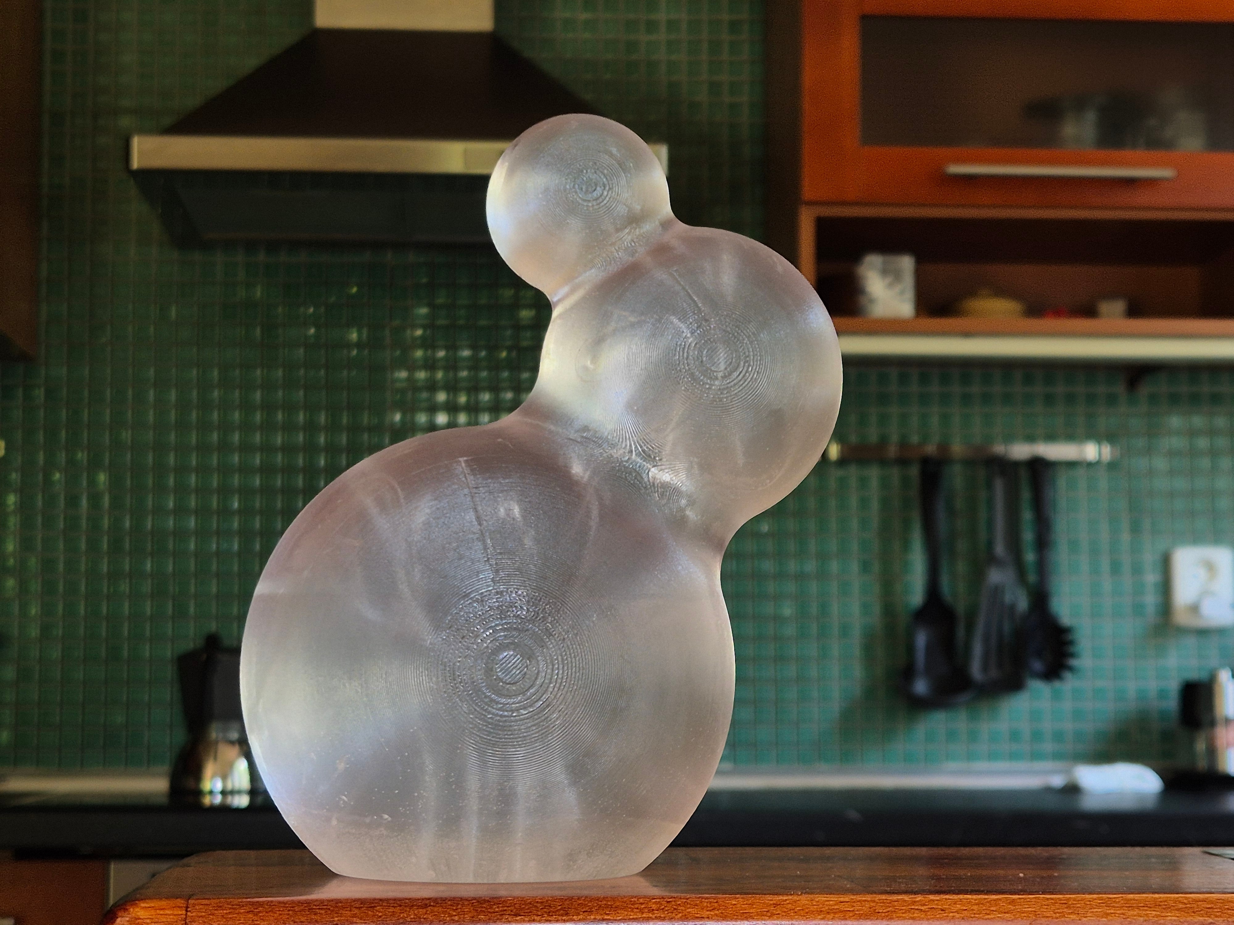 Iskanin — unlit translucent triple-sphere sculpture on a kitchen counter