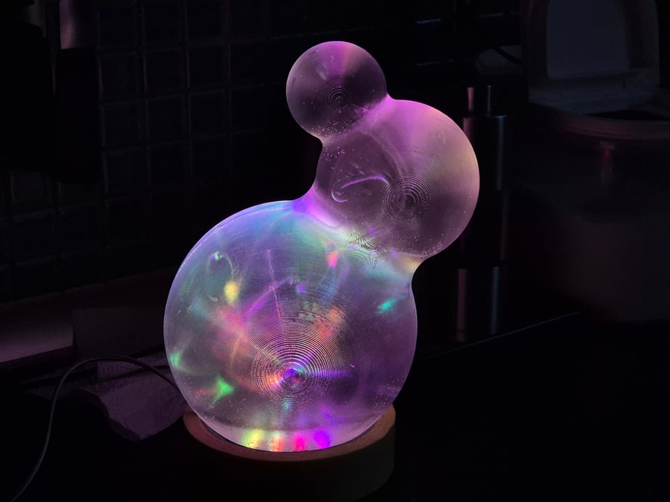 Iskanin — glowing 3D-printed translucent triple-sphere sculpture