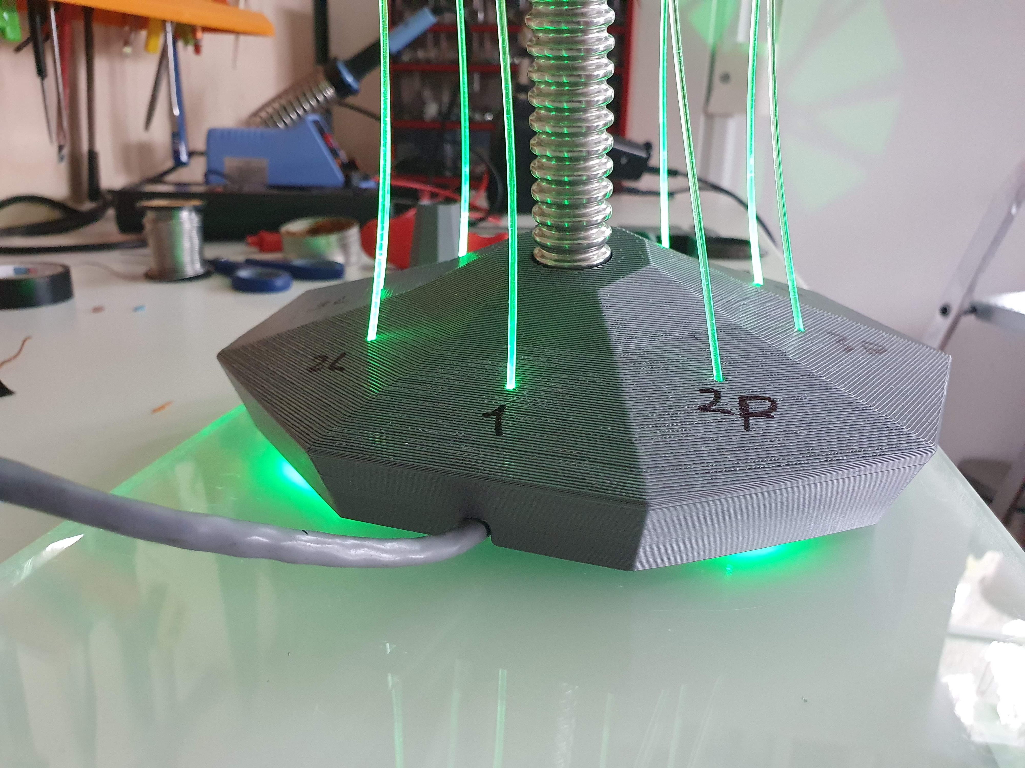 IXFID — 3D-printed faceted base with green fiber-optic strands and gooseneck arm